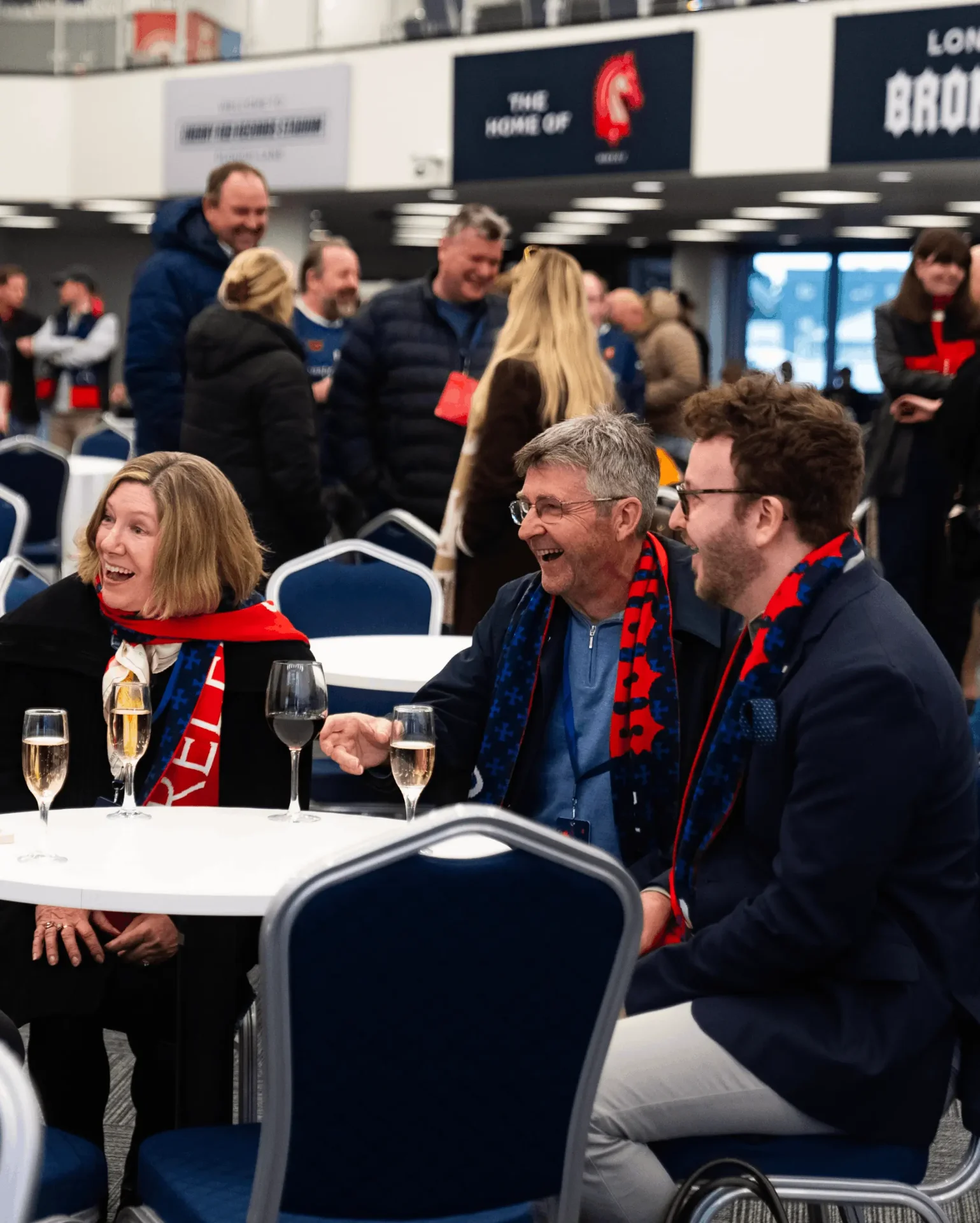 Fans enjoying drinks in the Broncos Bar at Cherry Red Records Stadium